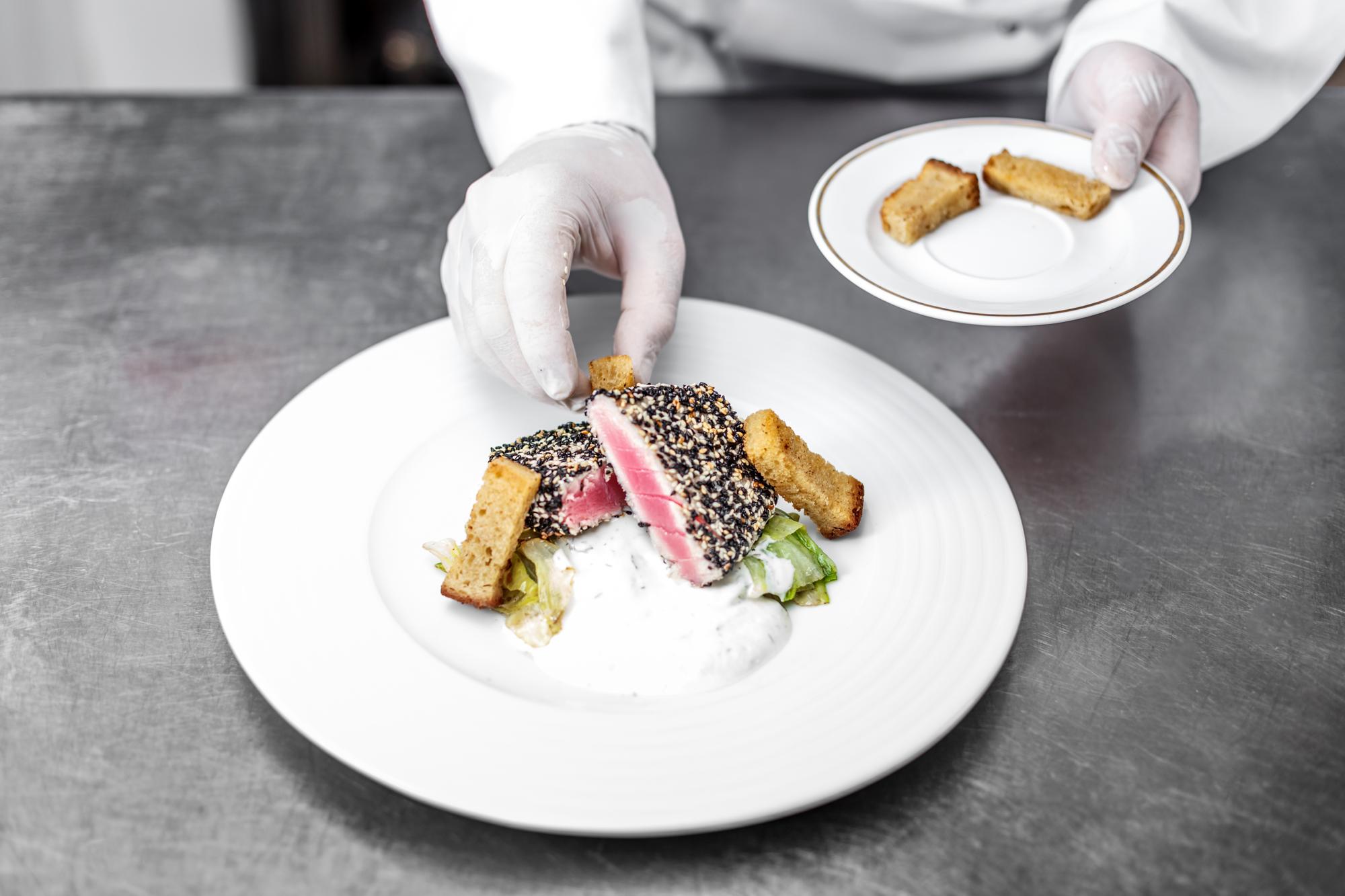 cheff preparing plated dish
